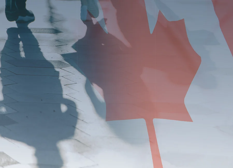 Canadian flag overlayed on people's shadows